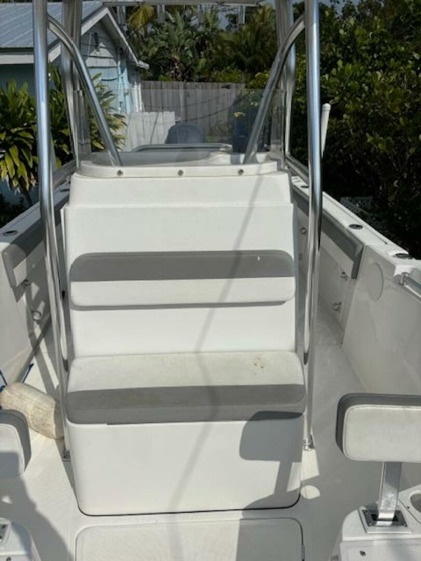Release-208 RX 2016 -Stuart-2016 Release 208 RX boat interior with seating and railing, surrounded by greenery.-5114926