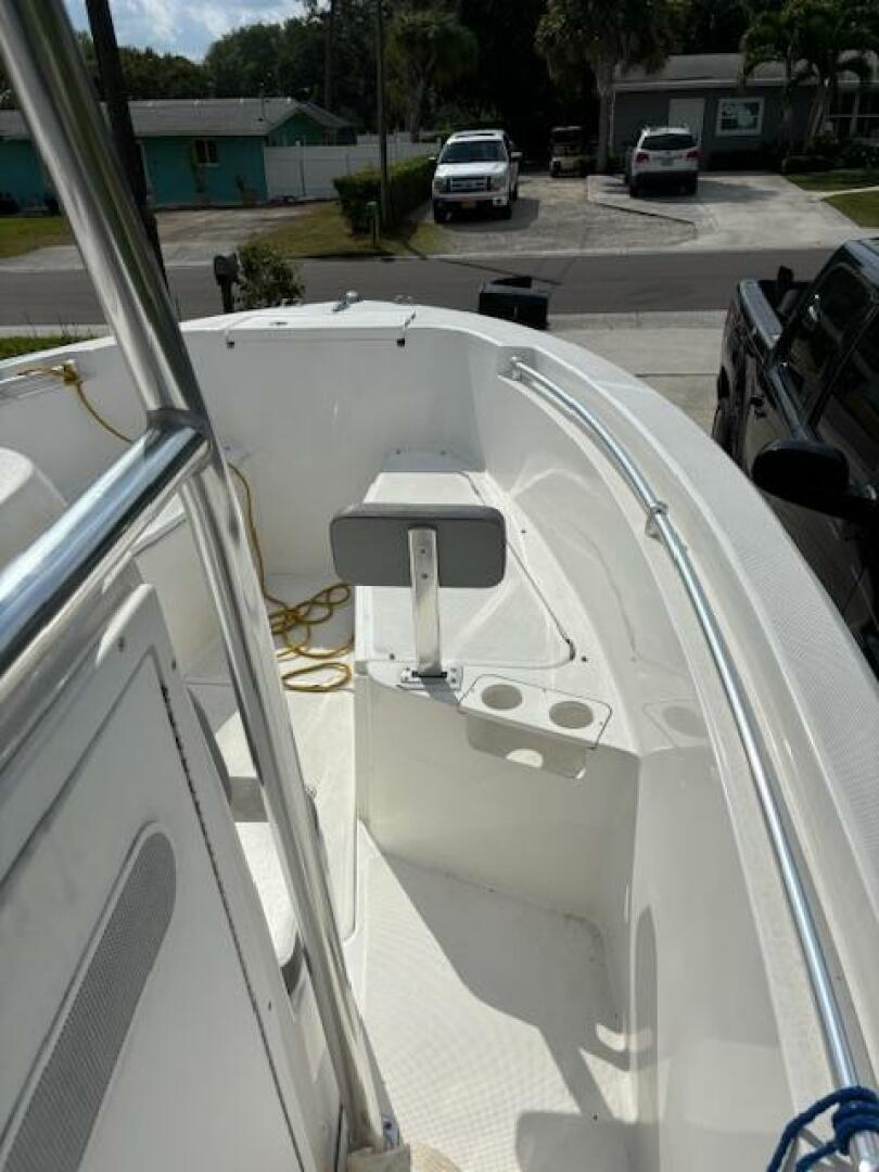 Release-208 RX 2016 -Stuart-2016 Release 208 RX boat interior with seating and rod holders, parked in a residential area.-5114923 | Thumbnail