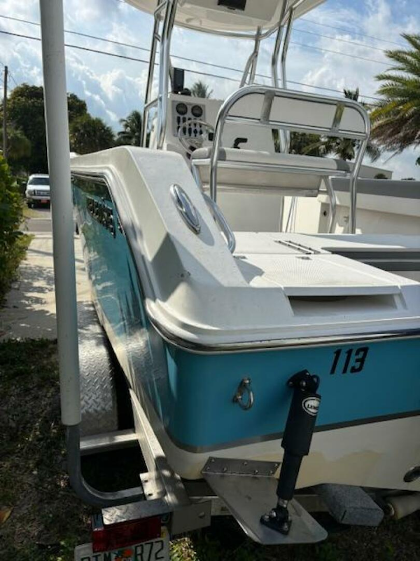 Release-208 RX 2016 -Stuart-2016 Release 208 RX boat with blue and white exterior on a trailer.-5114913