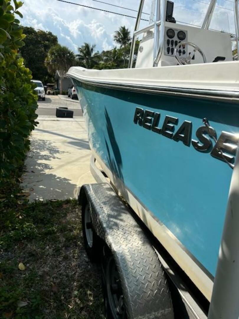 Release-208 RX 2016 -Stuart-2016 Release 208 RX boat on trailer, blue hull, parked outdoors.-5114912 | Thumbnail
