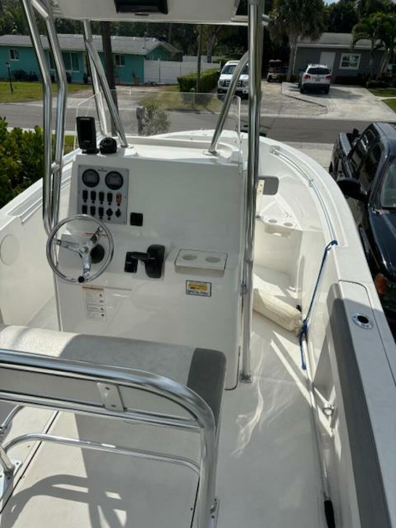 Release-208 RX 2016 -Stuart-2016 Release 208 RX boat with console and seating, parked in a residential area.-5114920 | Thumbnail