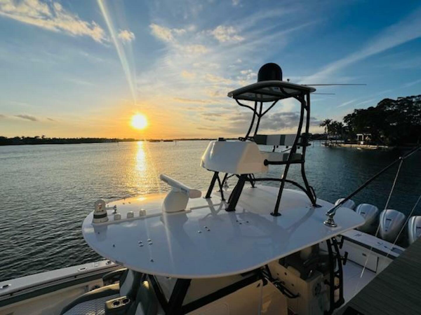 Regulator-41 2024-Fractional Ownership Available Stuart-2024 Regulator 41 boat at sunset on calm waters.-5234041