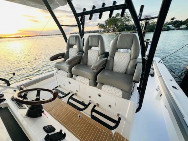 Regulator-41 2024-Fractional Ownership Available Stuart-2024 Regulator 41 boat interior with luxury seating at sunset on the water.-5234049