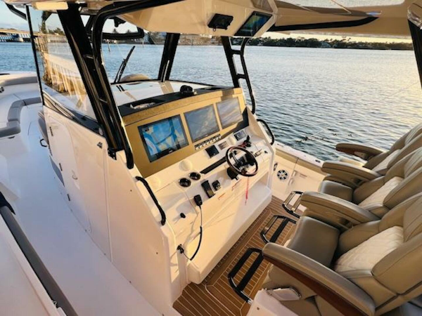 Regulator-41 2024-Fractional Ownership Available Stuart-2024 Regulator 41 boat cockpit with advanced navigation screens and luxurious seating.-5234037