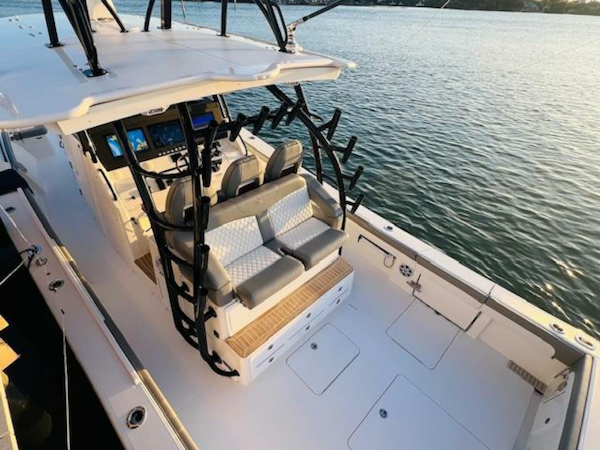 Regulator-41 2024-Fractional Ownership Available Stuart-2024 Regulator 41 boat with modern seating and control panel on calm water.-5234036