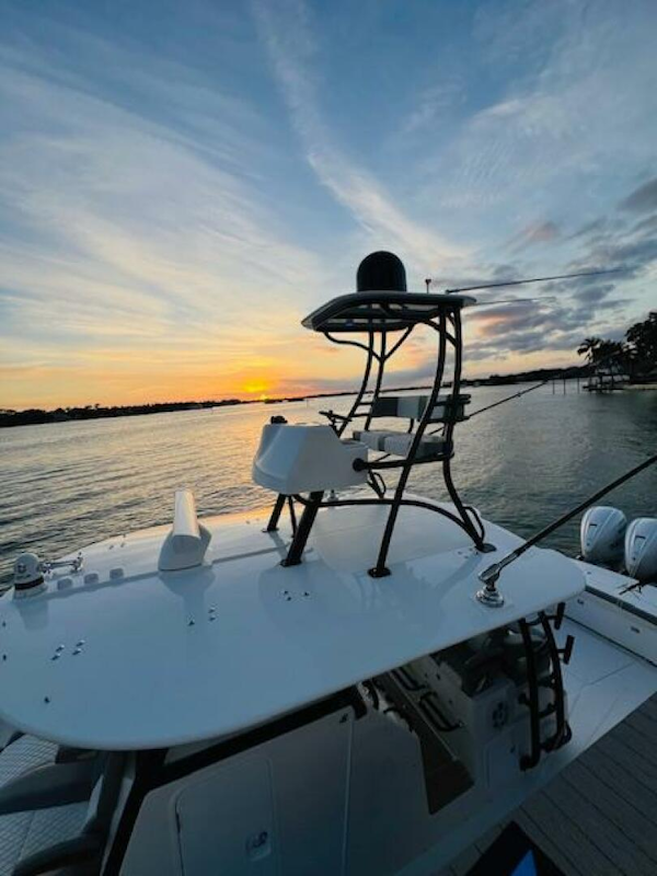 Regulator-41 2024-Fractional Ownership Available Stuart-2024 Regulator 41 boat at sunset on a serene lake.-5234057