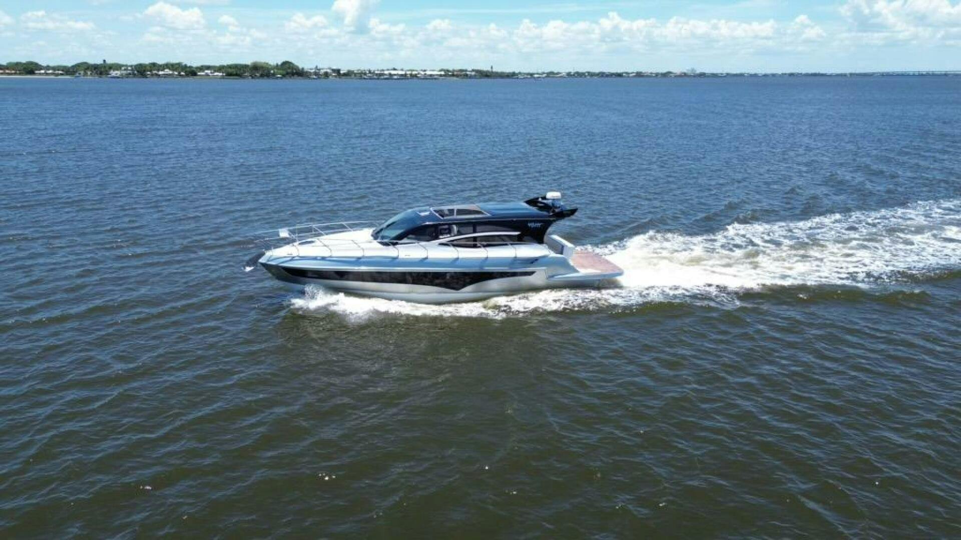 Real-40 HT Luxury  2025 -Stuart-2025 Real 40 HT Luxury yacht cruising on open water under a clear sky.-5405304