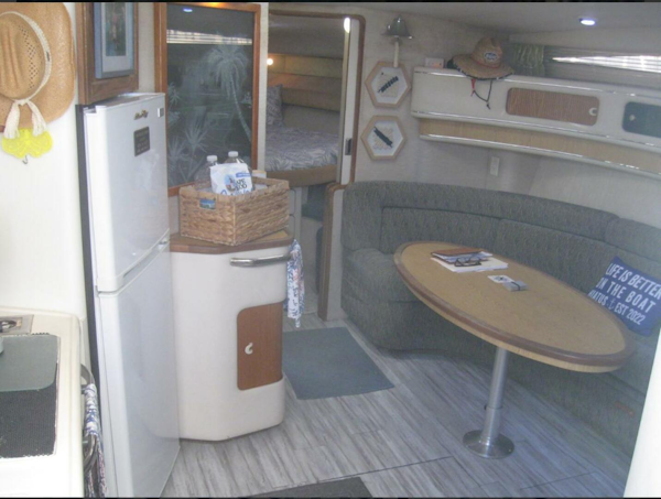 Sea Ray-440 Sundancer 1993 -Stuart-Interior of 1993 Sea Ray 440 Sundancer yacht with kitchenette and seating area.-5268567