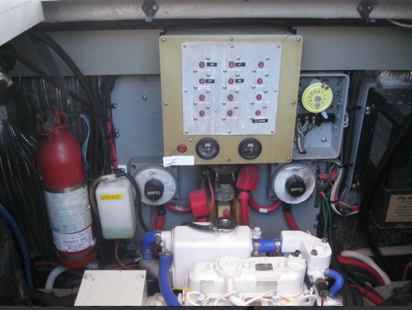Sea Ray-440 Sundancer 1993 -Stuart-Engine room of 1993 Sea Ray 440 Sundancer with control panel and fire extinguisher.-5268575 | Thumbnail