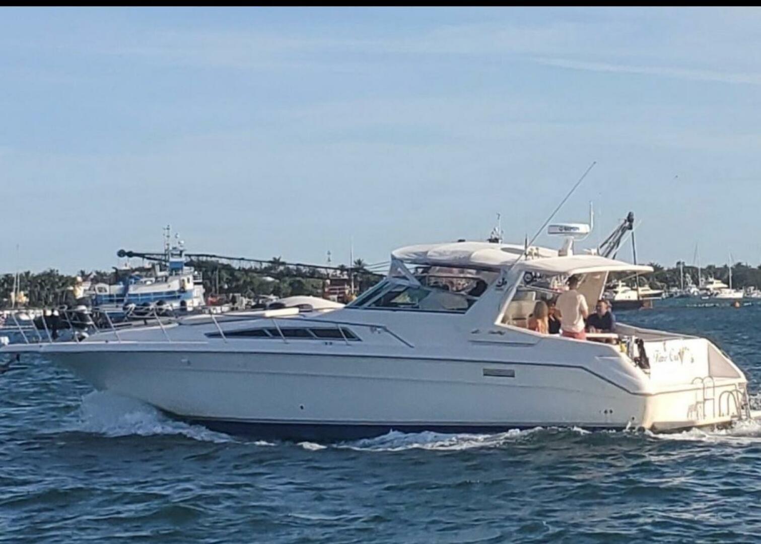 Sea Ray-440 Sundancer 1993 -Stuart-1993 Sea Ray 440 Sundancer yacht cruising on a sunny day with passengers onboard.-5268562 | Thumbnail