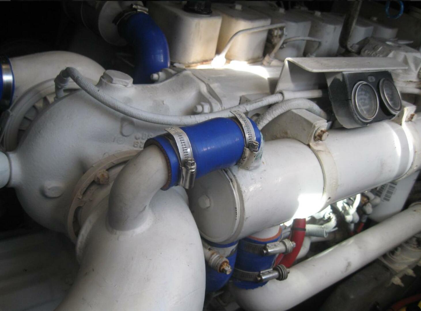 Sea Ray-440 Sundancer 1993 -Stuart-Engine components of a 1993 Sea Ray 440 Sundancer with blue hoses and clamps.-5268577 | Thumbnail