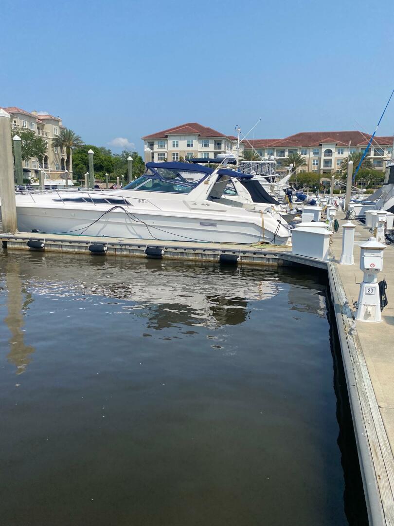 Sea Ray-440 Sundancer 1993 -Stuart-1993 Sea Ray 440 Sundancer docked at a marina with waterfront buildings in the background.-5402115 | Thumbnail