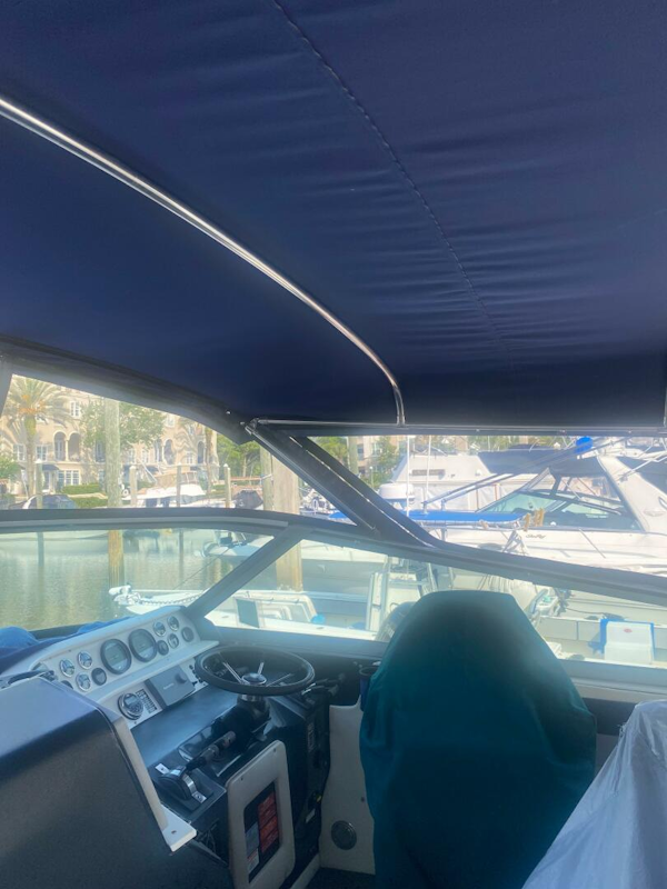Sea Ray-440 Sundancer 1993 -Stuart-Interior view of 1993 Sea Ray 440 Sundancer boat cockpit with blue canopy.-5402114