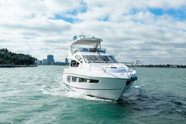 Sunseeker-Manhattan 65 2016 -Stuart-2016 Sunseeker Manhattan 65 yacht cruising on open water under a cloudy sky.-5314543