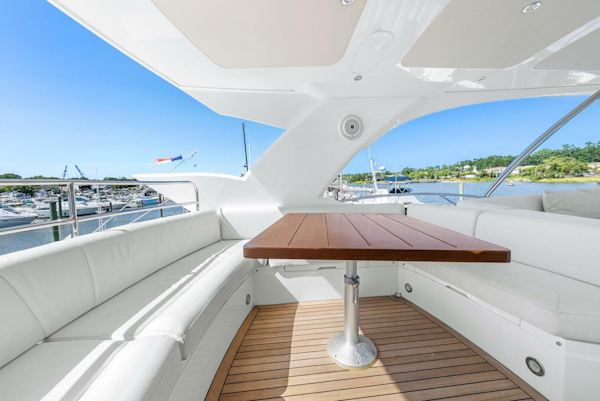 Sunseeker-Manhattan 65 2016 -Stuart-Luxurious Sunseeker Manhattan 65 yacht interior with elegant seating and wooden table, 2016 model.-5314548