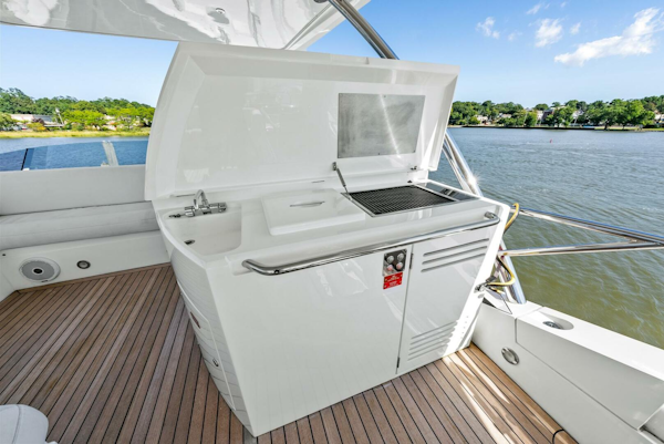 Sunseeker-Manhattan 65 2016 -Stuart-Outdoor kitchen on 2016 Sunseeker Manhattan 65 yacht, featuring grill and sink by the water.-5314558