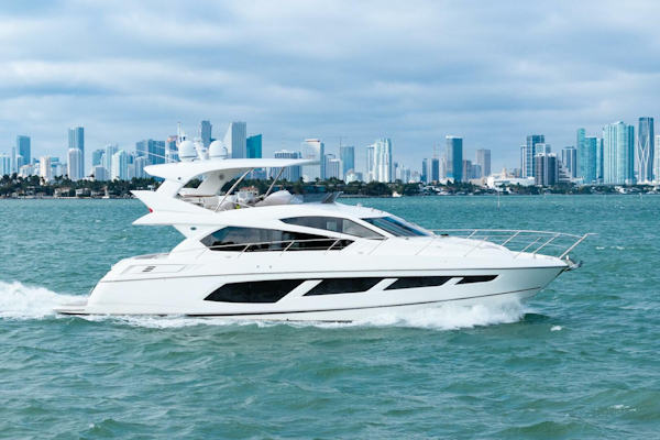 Sunseeker-Manhattan 65 2016 -Stuart-2016 Sunseeker Manhattan 65 yacht cruising with city skyline in the background.-5314524