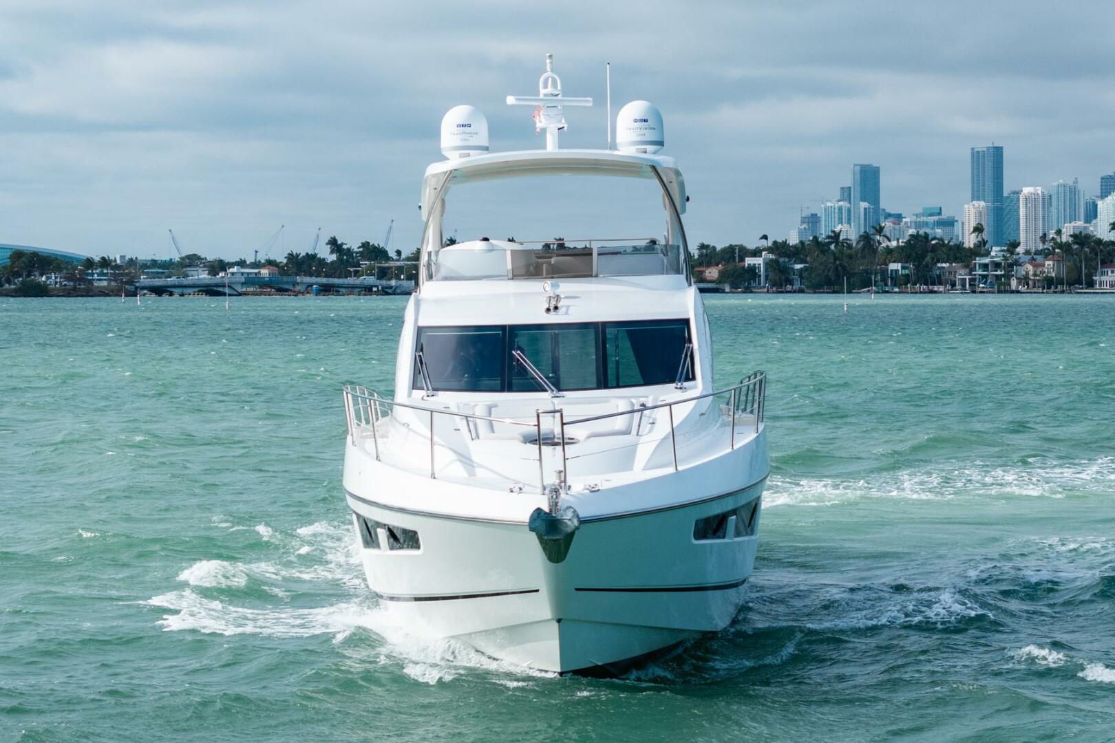 Sunseeker-Manhattan 65 2016 -Stuart-2016 Sunseeker Manhattan 65 yacht cruising in open water with city skyline backdrop.-5314530 | Thumbnail