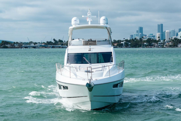 Sunseeker-Manhattan 65 2016 -Stuart-2016 Sunseeker Manhattan 65 yacht cruising in open water with city skyline backdrop.-5314530