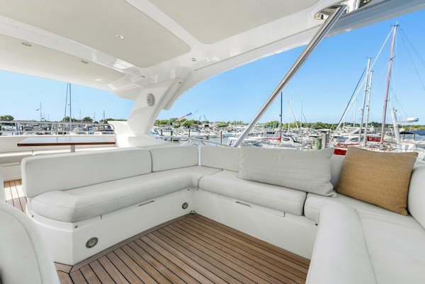 Sunseeker-Manhattan 65 2016 -Stuart-Luxurious Sunseeker Manhattan 65 yacht interior, 2016 model, featuring elegant white seating and marina view.-5314553