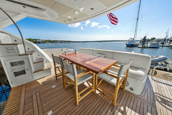 Sunseeker-Manhattan 65 2016 -Stuart-Luxurious Sunseeker Manhattan 65 yacht deck with dining area, overlooking marina, 2016 model.-5314562