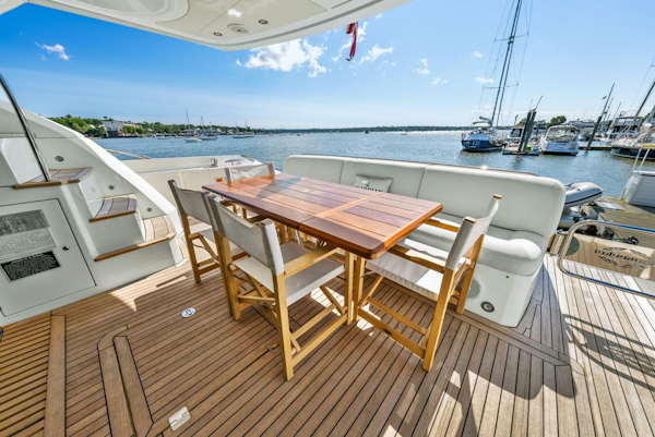 Sunseeker-Manhattan 65 2016 -Stuart-Luxury Sunseeker Manhattan 65 yacht deck with dining area, 2016 model, overlooking marina.-5314564