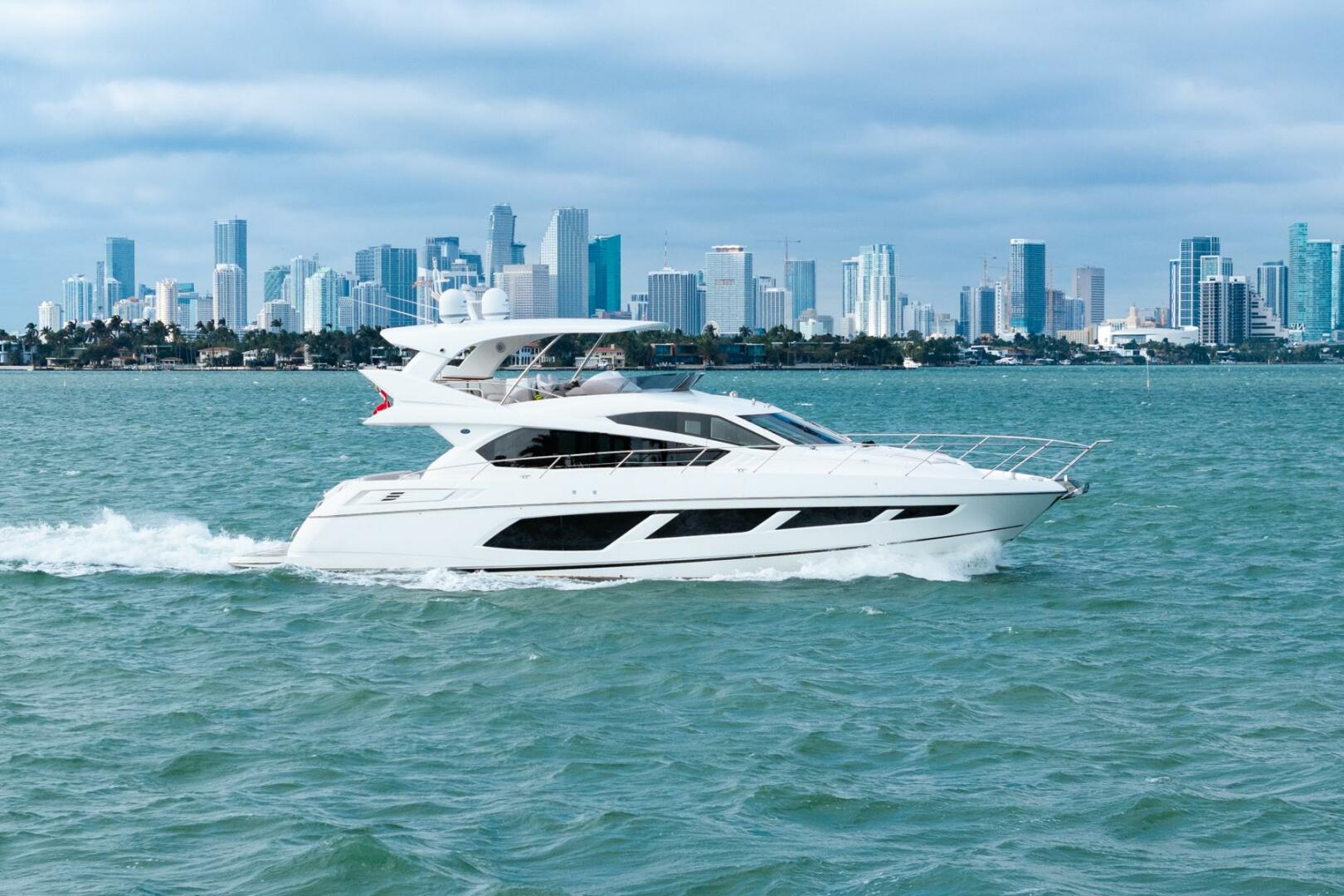 Sunseeker-Manhattan 65 2016 -Stuart-2016 Sunseeker Manhattan 65 yacht cruising with city skyline backdrop.-5314523 | Thumbnail