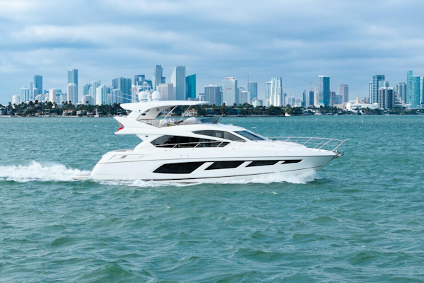 Sunseeker-Manhattan 65 2016 -Stuart-2016 Sunseeker Manhattan 65 yacht cruising with city skyline backdrop.-5314523