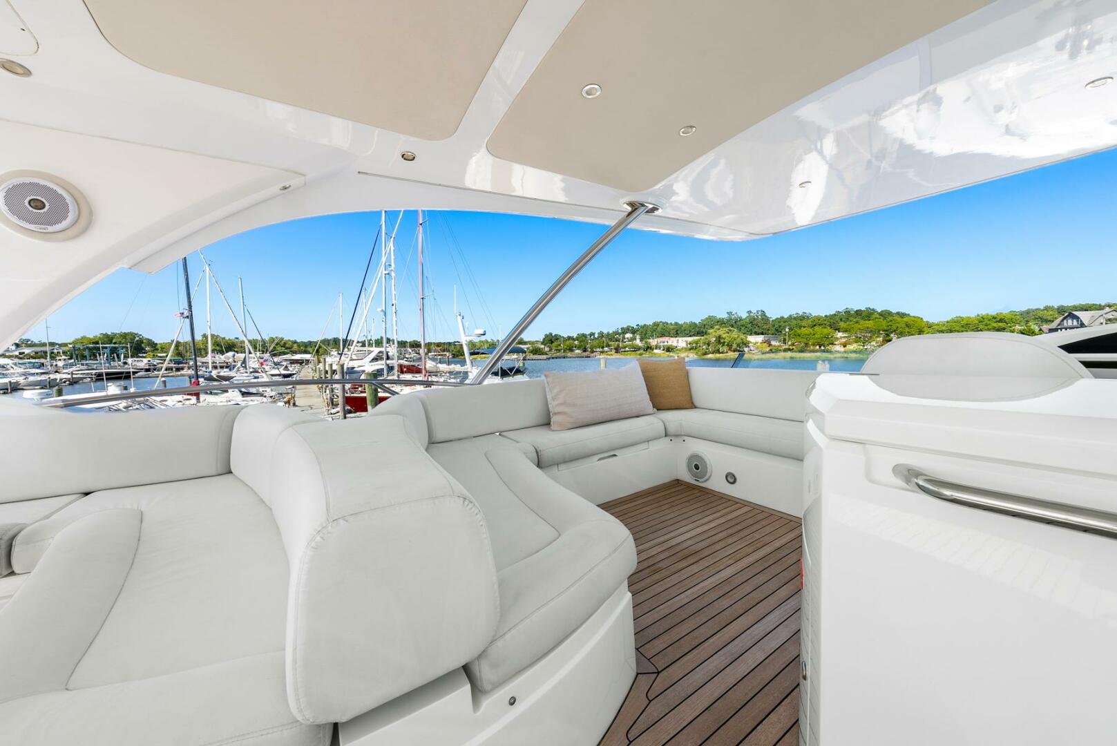 Sunseeker-Manhattan 65 2016 -Stuart-Luxurious 2016 Sunseeker Manhattan 65 yacht interior with white seating and wooden deck.-5314551 | Thumbnail