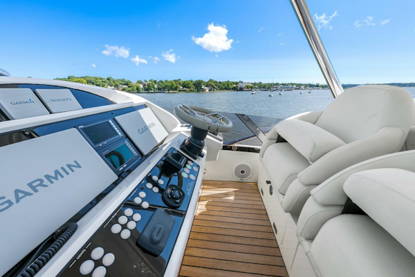 Sunseeker-Manhattan 65 2016 -Stuart-2016 Sunseeker Manhattan 65 yacht helm with Garmin navigation, overlooking serene waters.-5314546