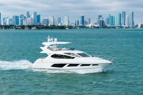 Sunseeker-Manhattan 65 2016 -Stuart-2016 Sunseeker Manhattan 65 yacht cruising with city skyline backdrop.-5314525