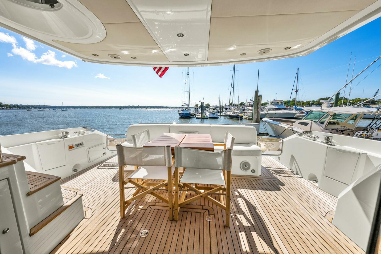 Sunseeker-Manhattan 65 2016 -Stuart-Luxury Sunseeker Manhattan 65 yacht deck with seating, overlooking marina, 2016 model.-5314560 | Thumbnail