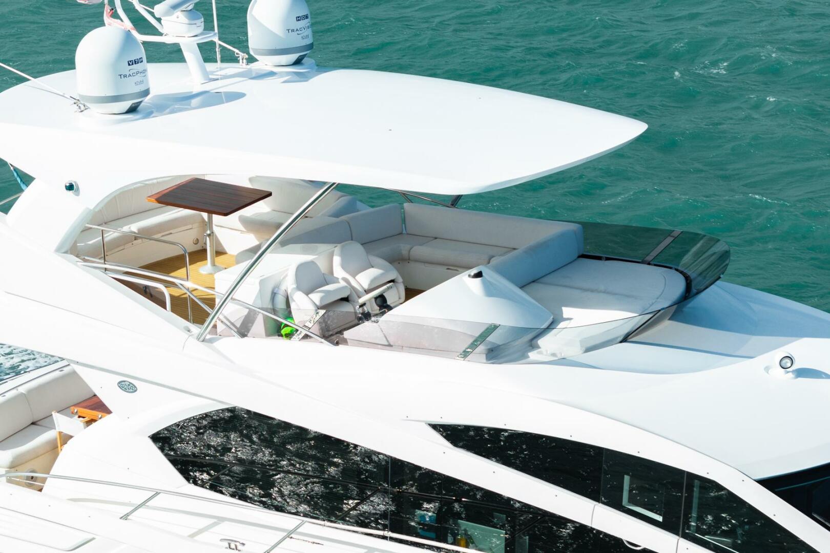 Sunseeker-Manhattan 65 2016 -Stuart-2016 Sunseeker Manhattan 65 yacht with spacious deck and seating, cruising on blue water.-5314535 | Thumbnail
