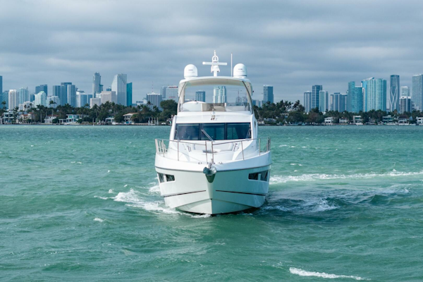 Sunseeker-Manhattan 65 2016 -Stuart-2016 Sunseeker Manhattan 65 yacht cruising with city skyline in the background.-5314529