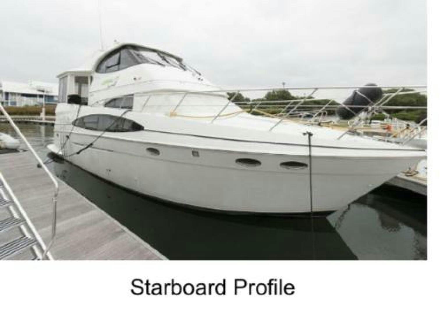 Carver-506 Motor Yacht 2000 -Stuart-2000 Carver 506 Motor Yacht, starboard view, docked in marina.-5367850