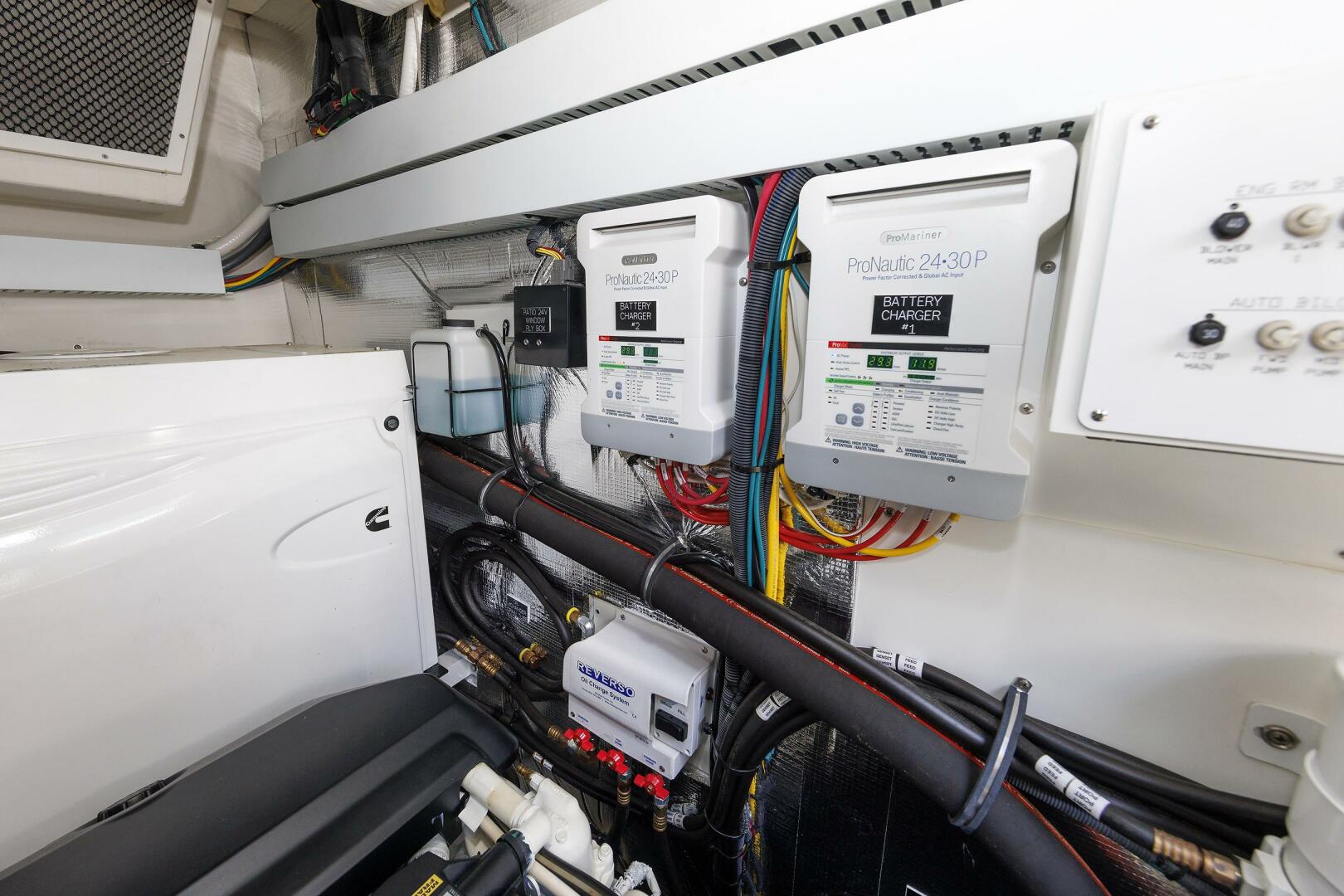 Cruisers Yachts 2021-Wicked Nauti Danvers-Massachusetts-United States-Engine Room   Chargers-5482732 | Thumbnail