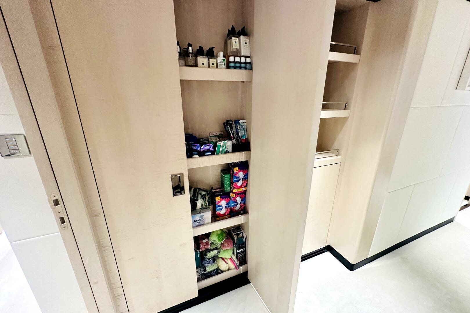 Majesty Yachts-120 2024-Optimism Stuart-Florida-United States-Modern pantry shelves in a 2023 Majesty 120 yacht, stocked with toiletries and snacks.-5695591 | Thumbnail