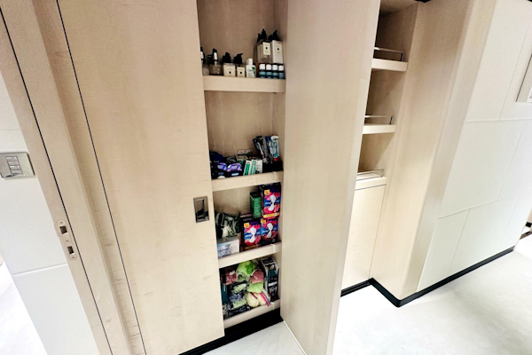 Majesty Yachts-120 2024-Optimism Stuart-Florida-United States-Modern pantry shelves in a 2023 Majesty 120 yacht, stocked with toiletries and snacks.-5695591