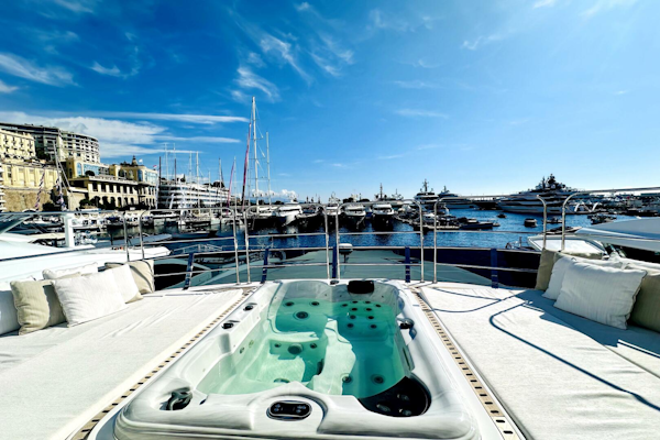Majesty Yachts-120 2024-Optimism Stuart-Florida-United States-Luxurious 2023 Majesty 120 yacht with jacuzzi, docked in a scenic marina under a clear blue sky.-5695563