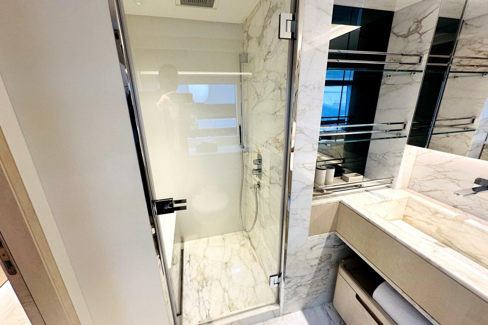 Majesty Yachts-120 2024-Optimism Stuart-Florida-United States-Luxurious marble bathroom in 2023 Majesty 120 yacht, featuring glass shower and modern fixtures.-5695571 | Thumbnail