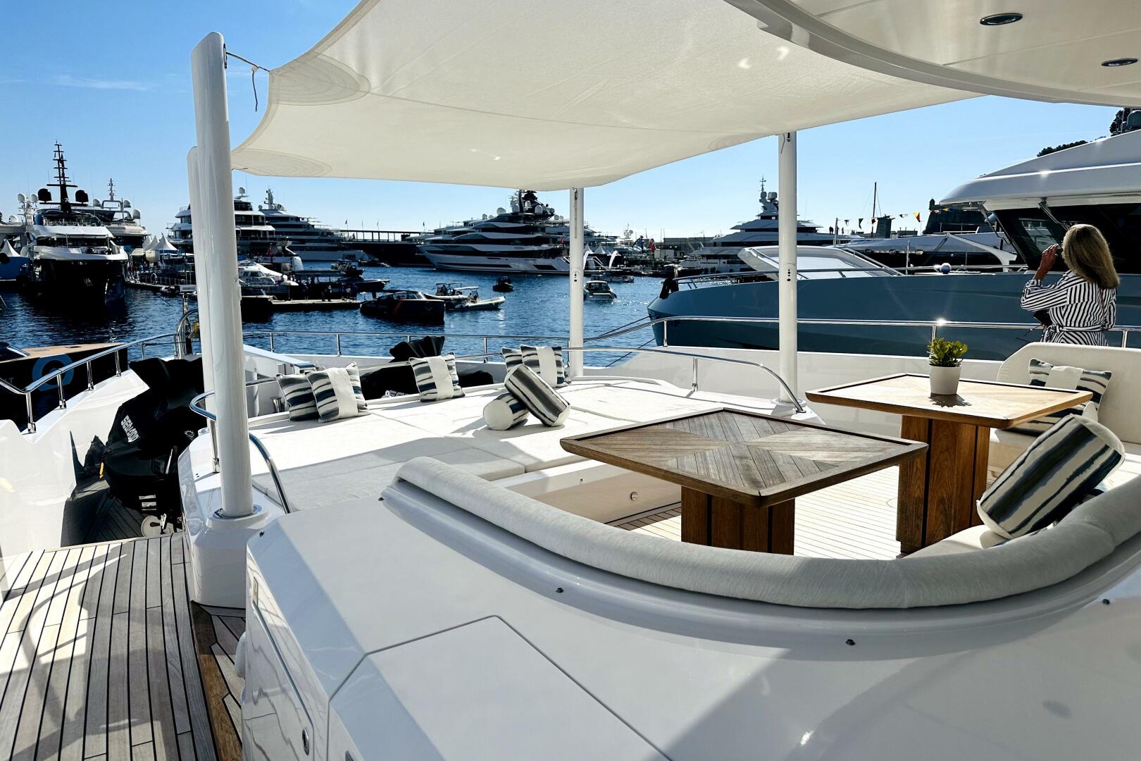 Majesty Yachts-120 2024-Optimism Stuart-Florida-United States-Luxurious 2023 Majesty 120 yacht deck with elegant seating, overlooking marina filled with yachts.-5695562 | Thumbnail