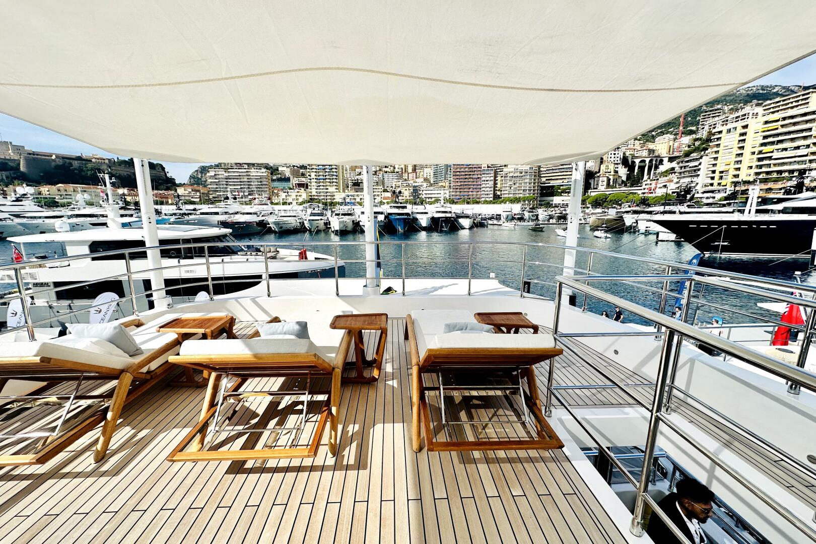 Majesty Yachts-120 2024-Optimism Stuart-Florida-United States-Luxurious 2023 Majesty 120 yacht deck with sun loungers, overlooking a marina.-5695561 | Thumbnail