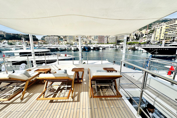 Majesty Yachts-120 2024-Optimism Stuart-Florida-United States-Luxurious 2023 Majesty 120 yacht deck with sun loungers, overlooking a marina.-5695561