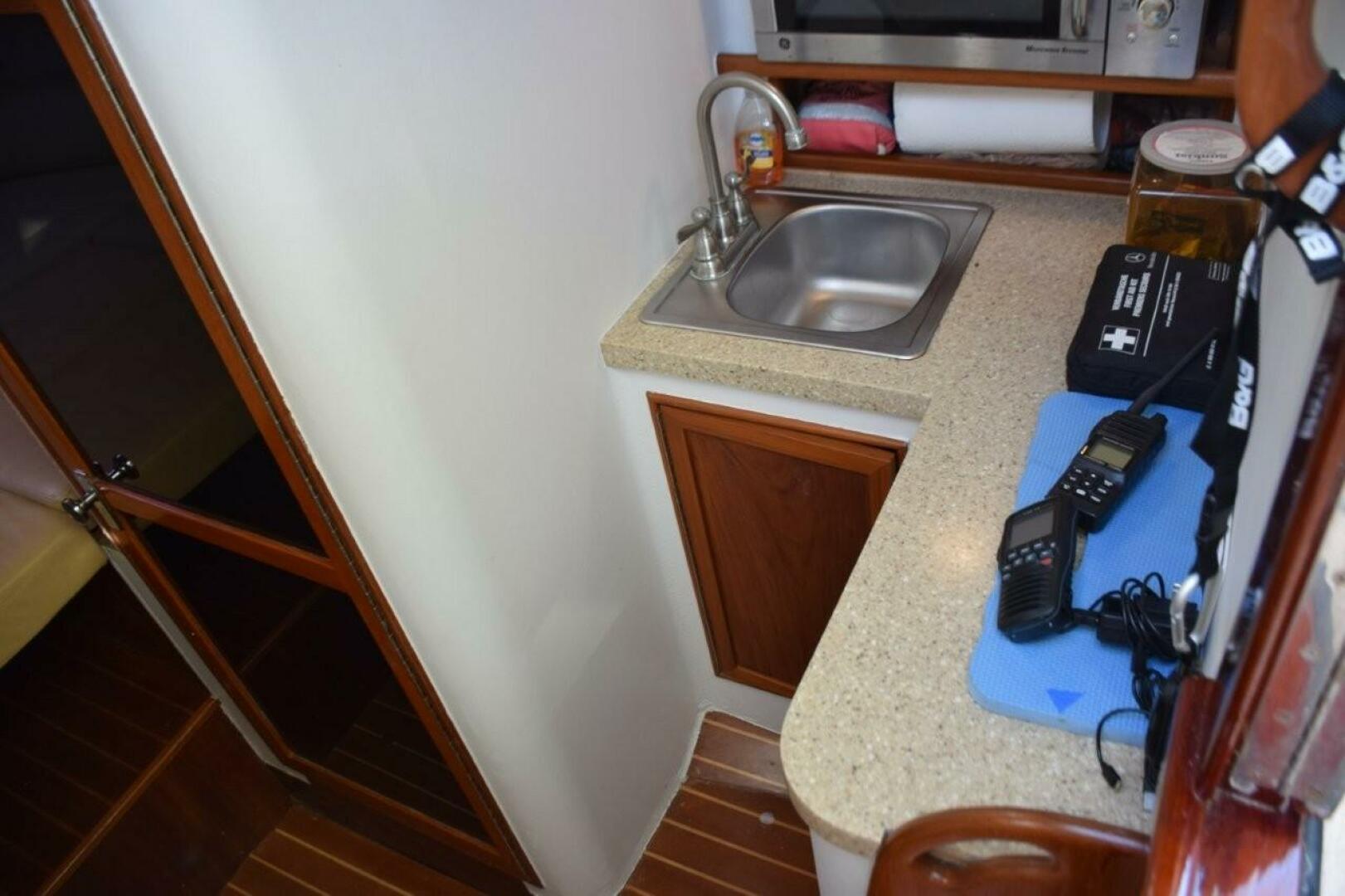 Custom Carolina-Dixon Boatworks Express 2008-OSPREY Stuart-Florida-United States-Galley Area With GE Microwave Oven-5806589 | Thumbnail